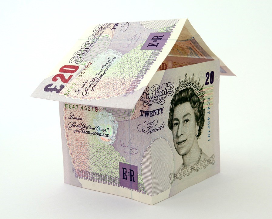 Origami house made out of 20 pound notes