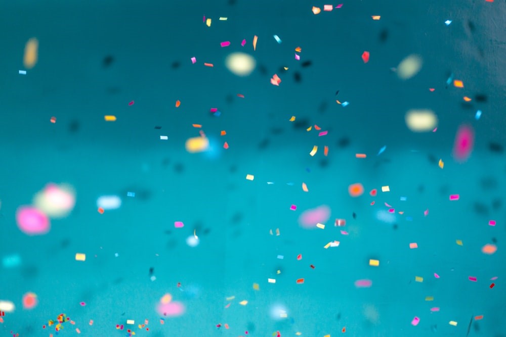 confetti against a blue background
